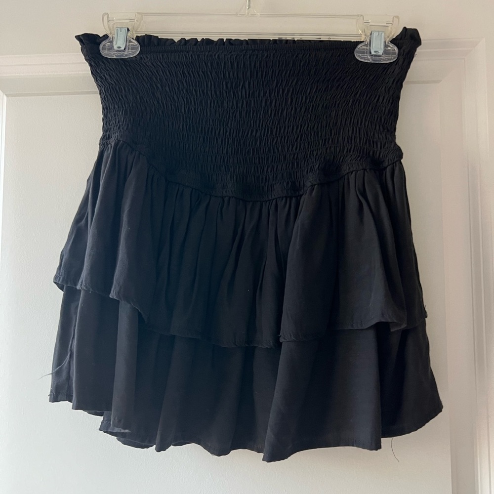 Black ruffle mini skirt